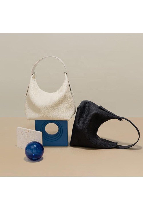 Half-moon shape soft pebbled leather handbag