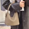 Half-moon shape soft pebbled leather handbag
